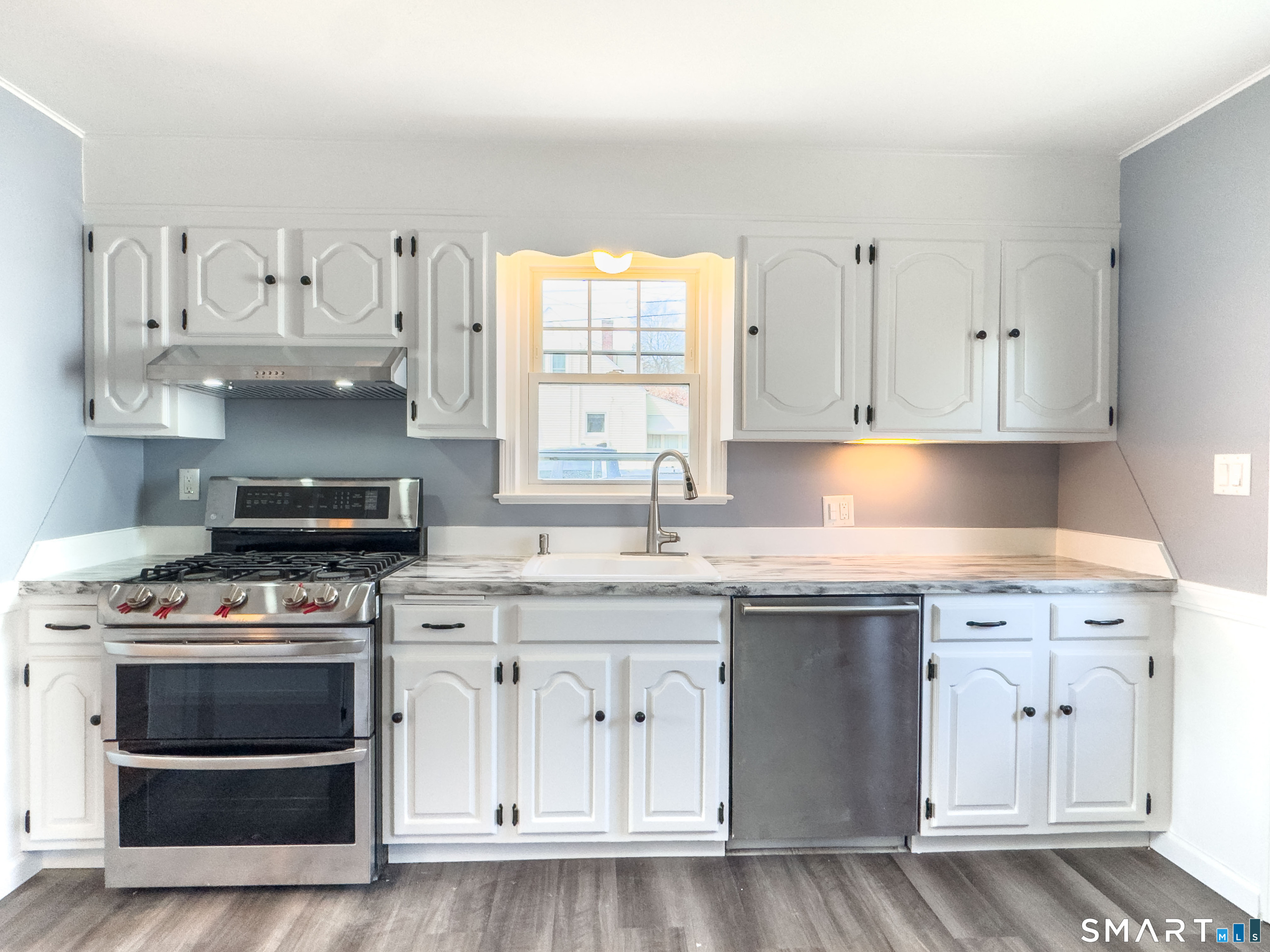 27 Glendale Drive Waterbury, CT 06708 - Photo 7 of 27 a kitchen with cabinets appliances and a window