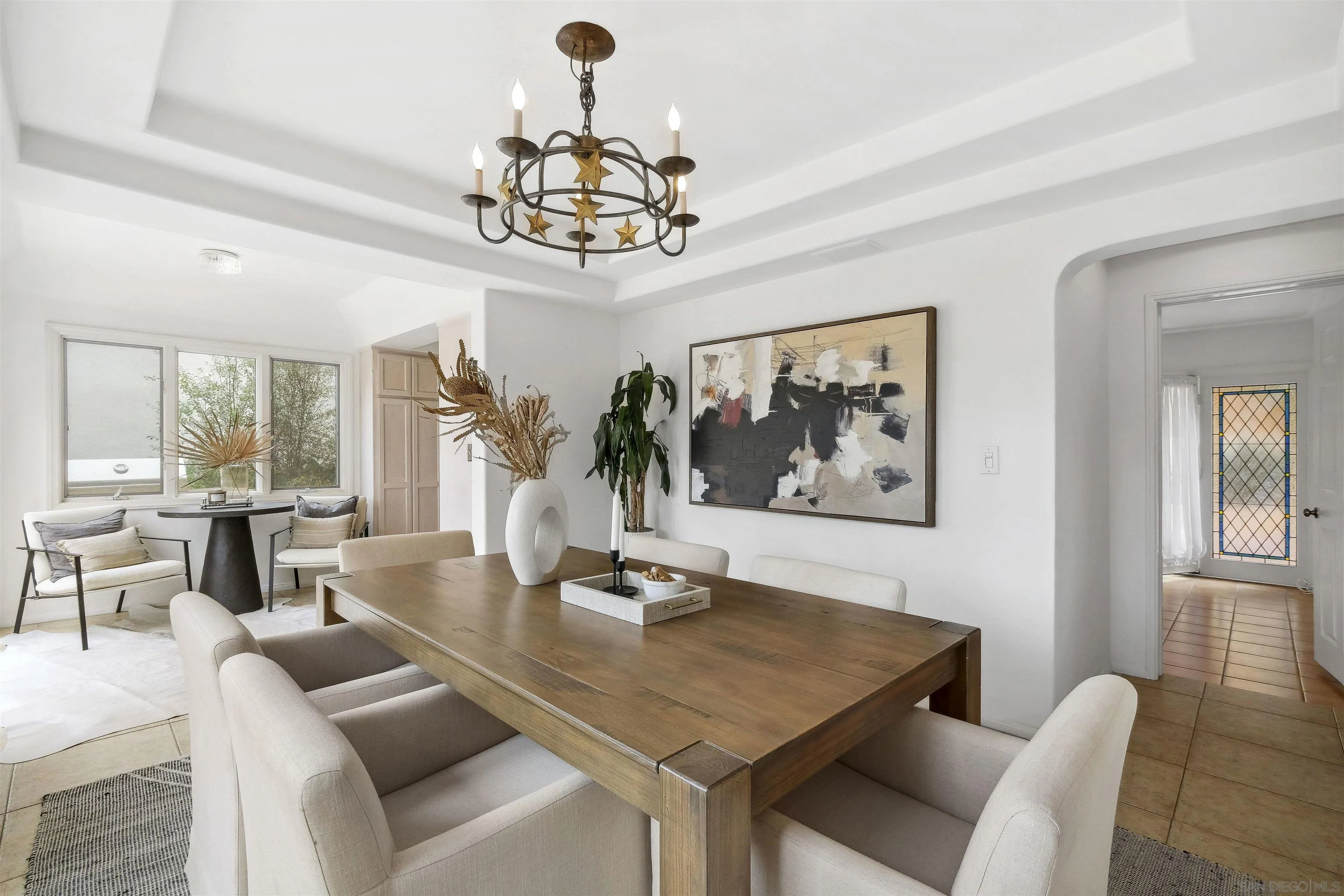 1937 Paseo Dorado La Jolla, CA 92037 - Photo 24 of 53 a view of a dining room with furniture a chandelier and wooden floor