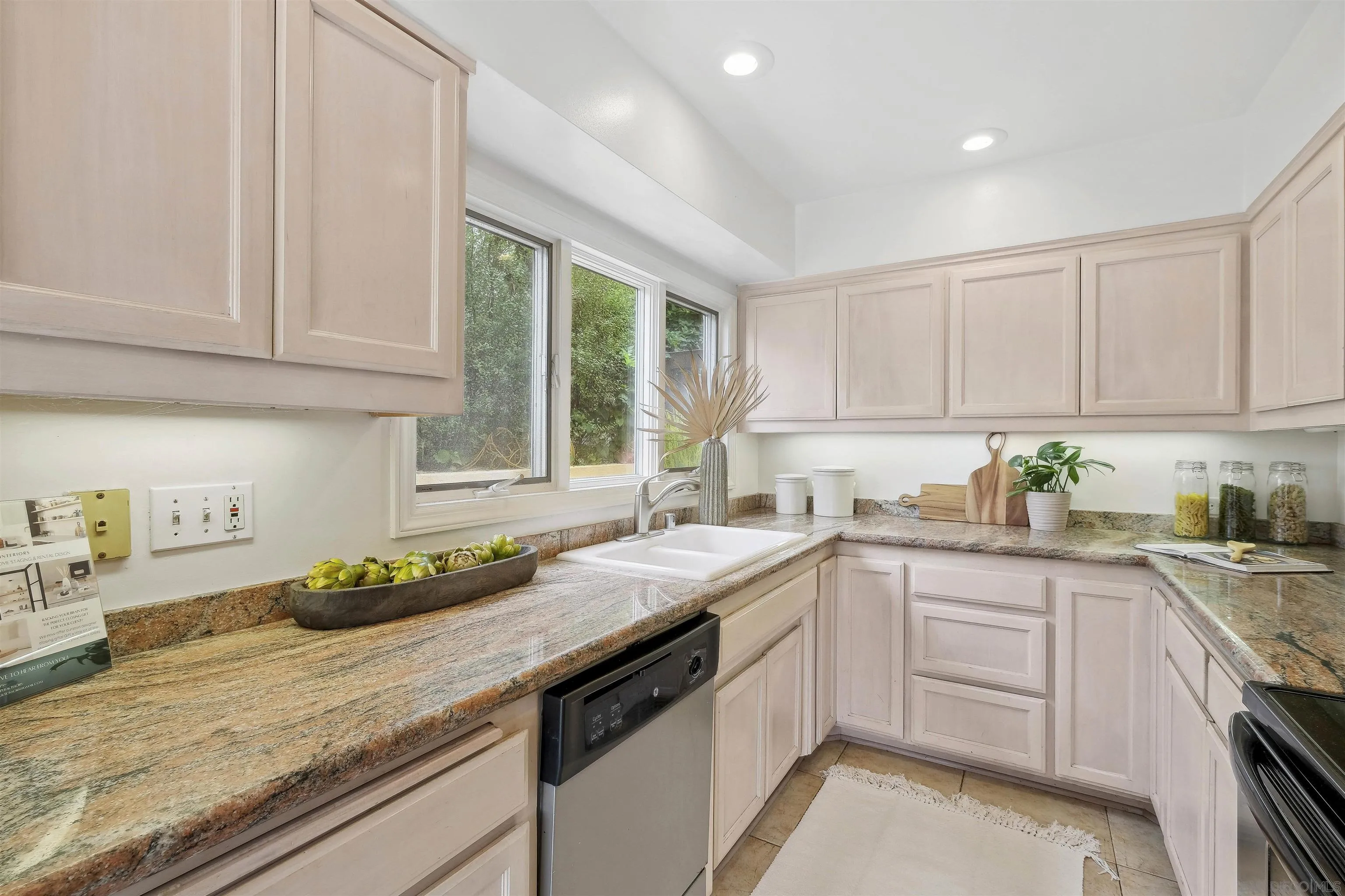 1937 Paseo Dorado La Jolla, CA 92037 - Photo 26 of 53 a kitchen with a sink stove and cabinets