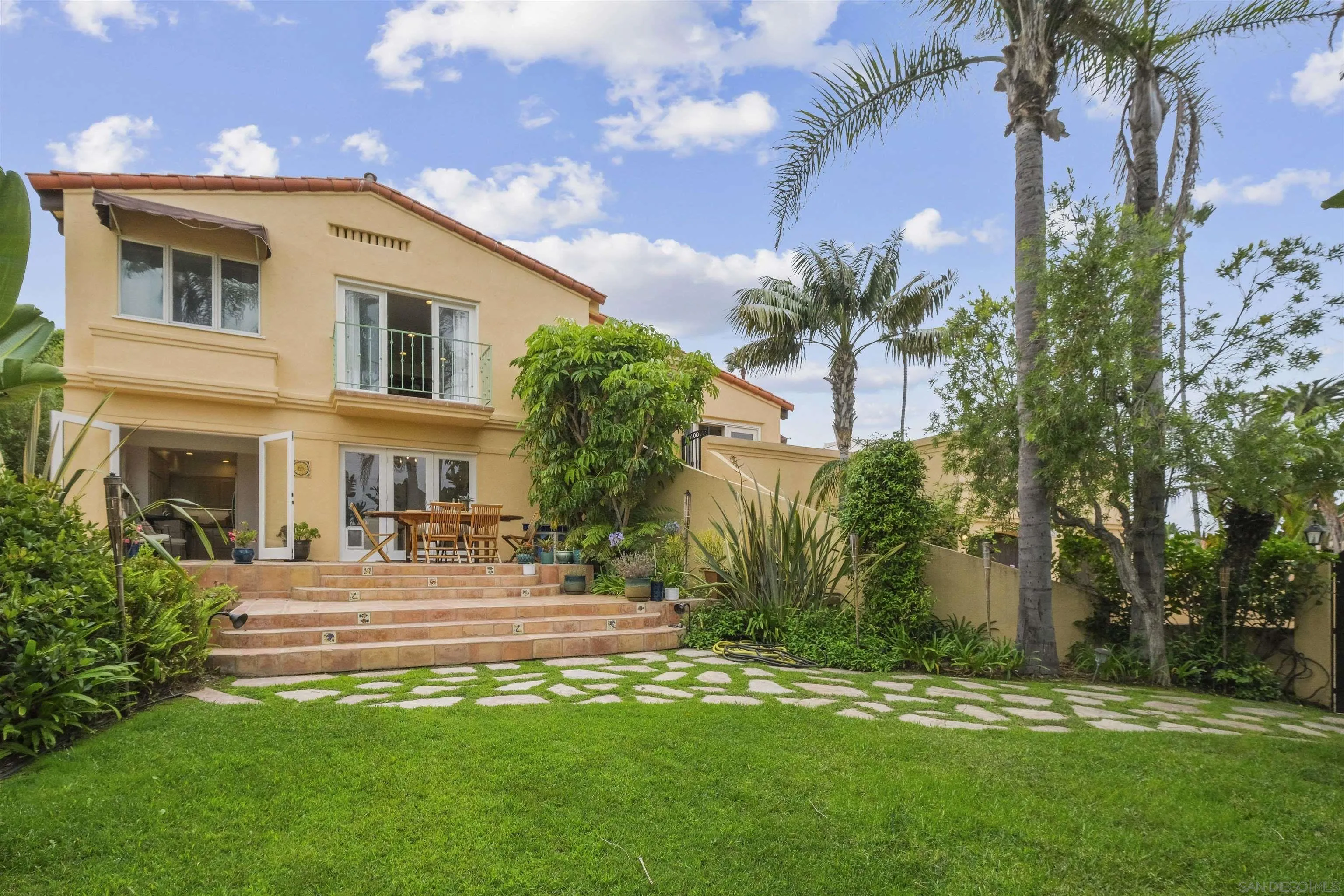 1937 Paseo Dorado La Jolla, CA 92037 - Photo 3 of 53 a front view of a house with a garden