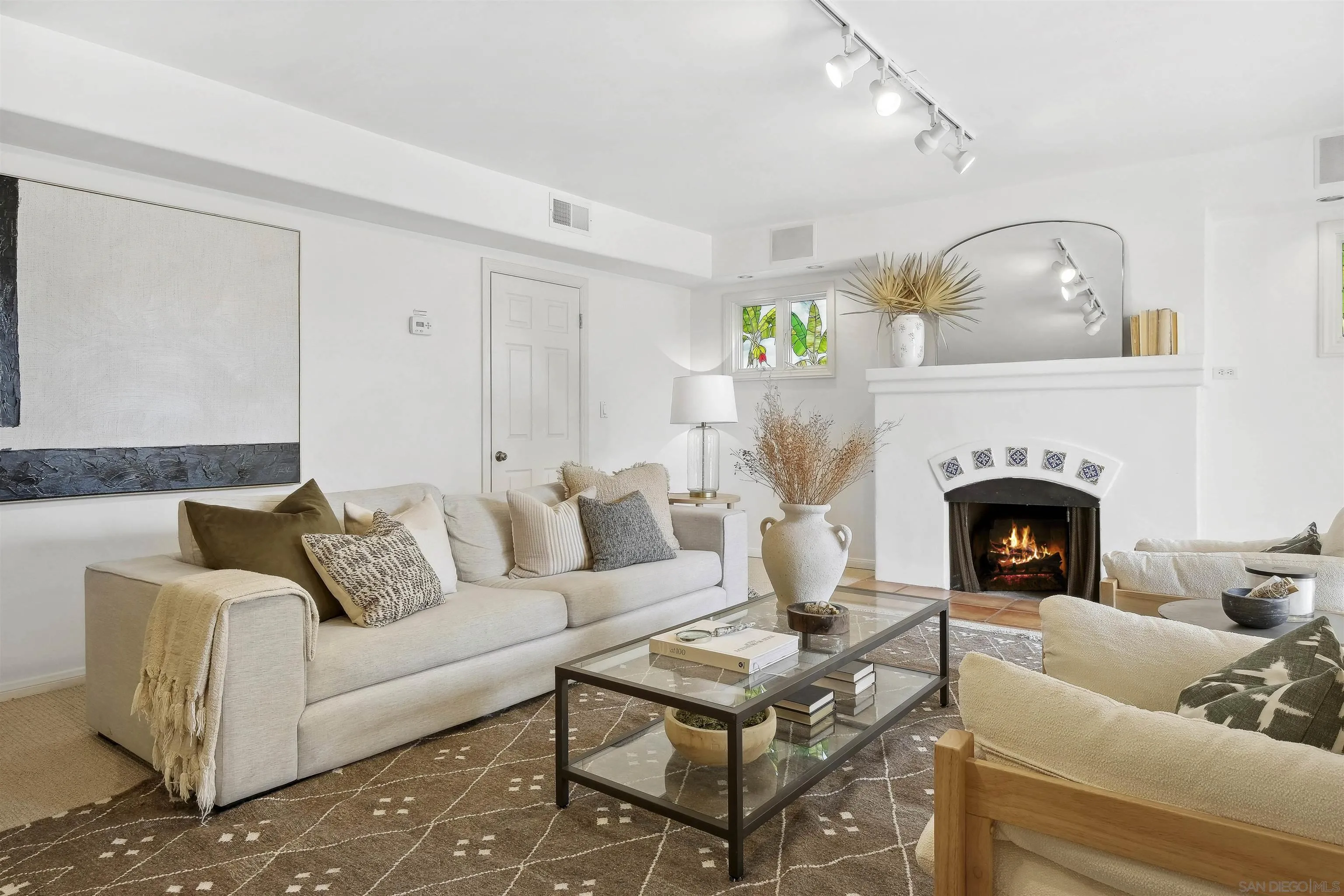 1937 Paseo Dorado La Jolla, CA 92037 - Photo 36 of 53 a living room with furniture and a fireplace