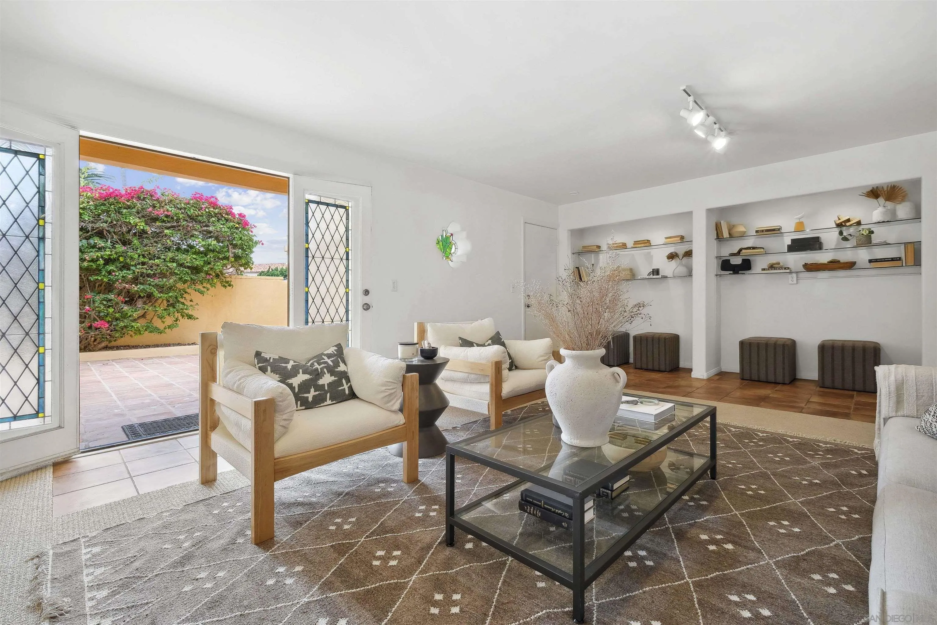 1937 Paseo Dorado La Jolla, CA 92037 - Photo 37 of 53 a living room with furniture a rug and a large window