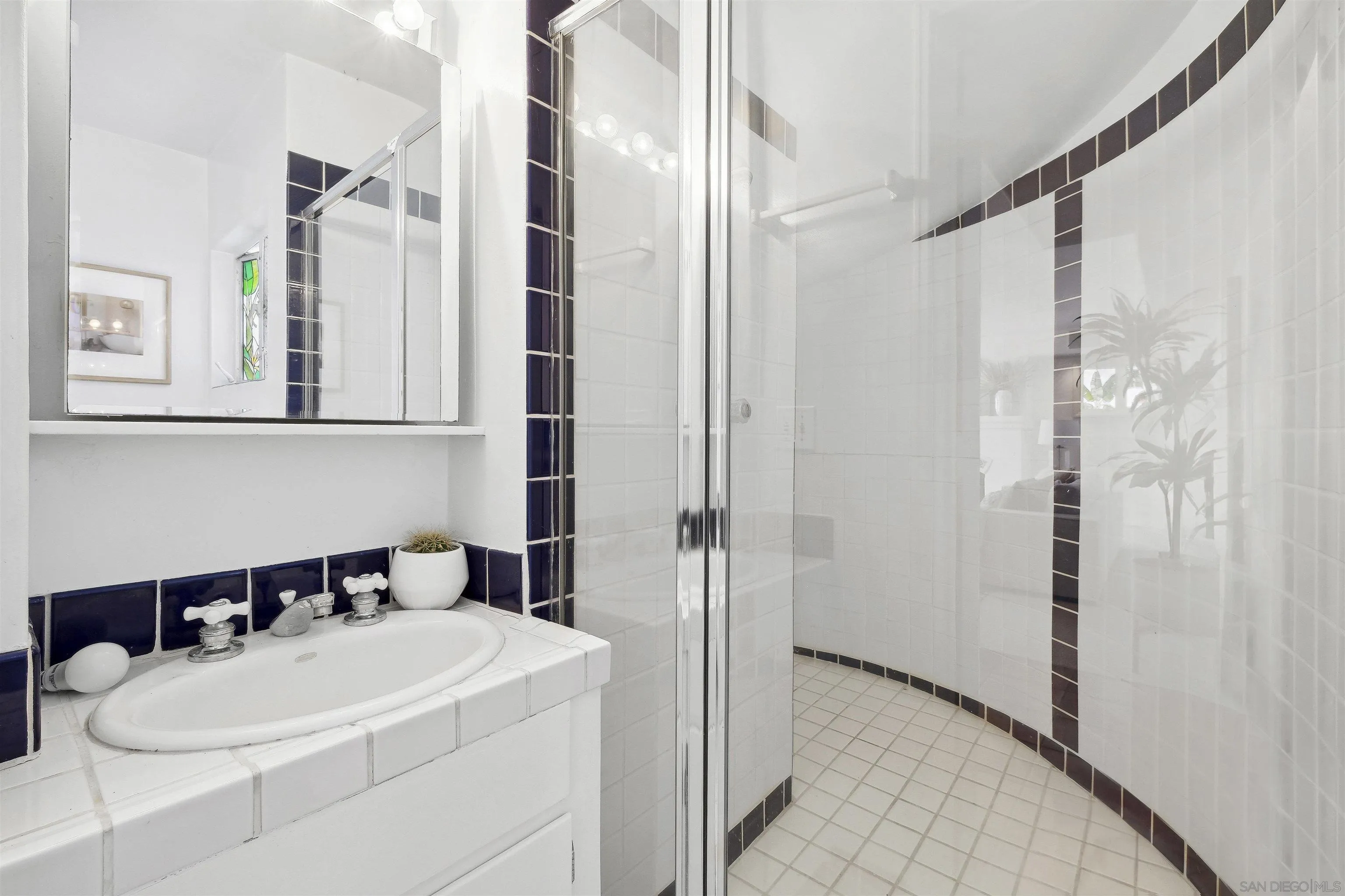 1937 Paseo Dorado La Jolla, CA 92037 - Photo 38 of 53 a bathroom with a sink and a mirror