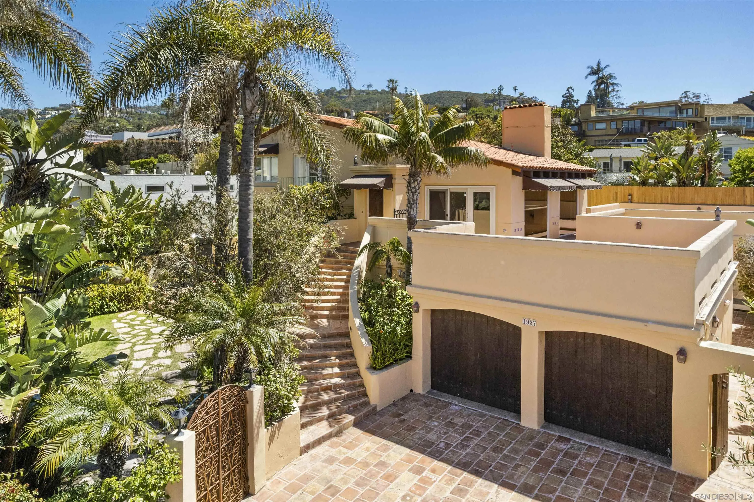 1937 Paseo Dorado La Jolla, CA 92037 - Photo 4 of 53 a front view of a house with a yard