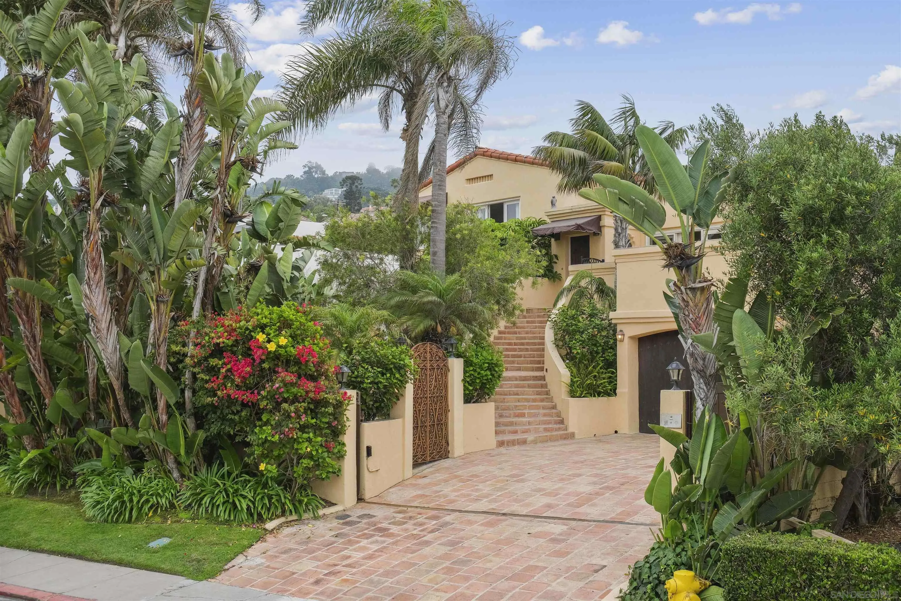 1937 Paseo Dorado La Jolla, CA 92037 - Photo 5 of 53 a front view of a house with a garden