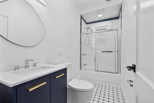 a bathroom with a shower and toilet