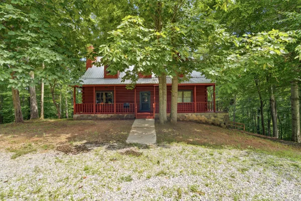 a front view of a house with a yard and porch