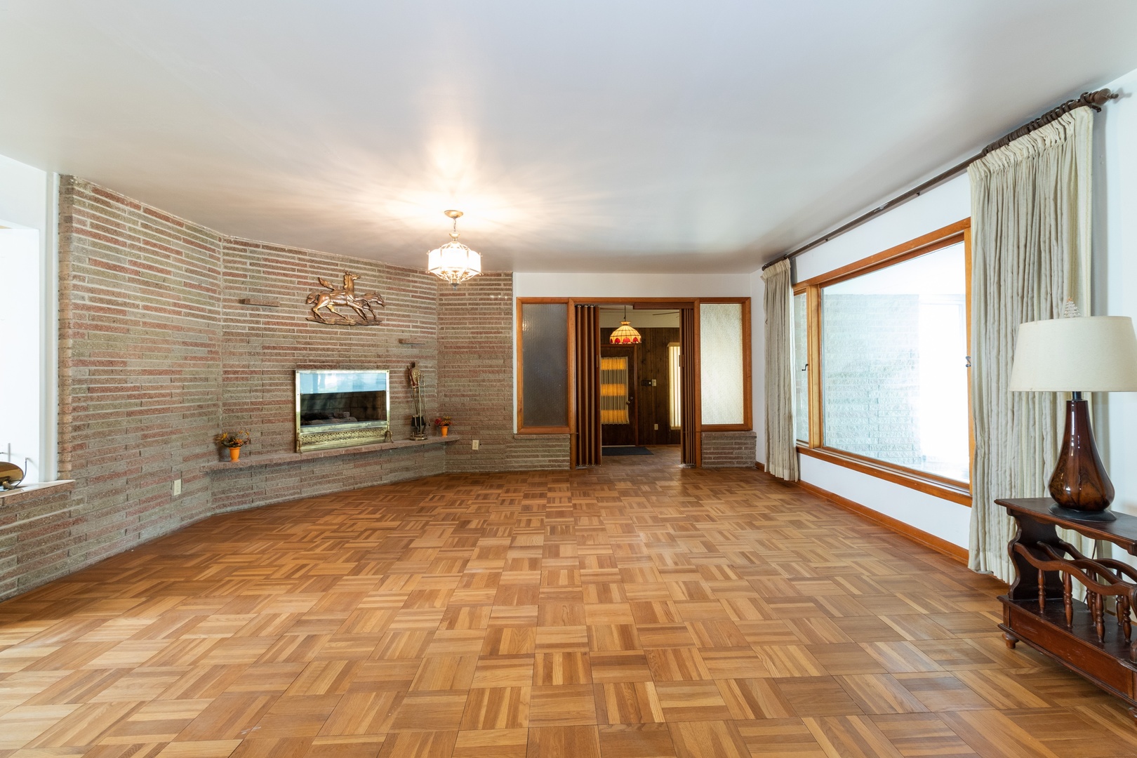 3604 177th Place Lansing, IL 60438 - Photo 2 of 13 a view of a livingroom with a fireplace and a window