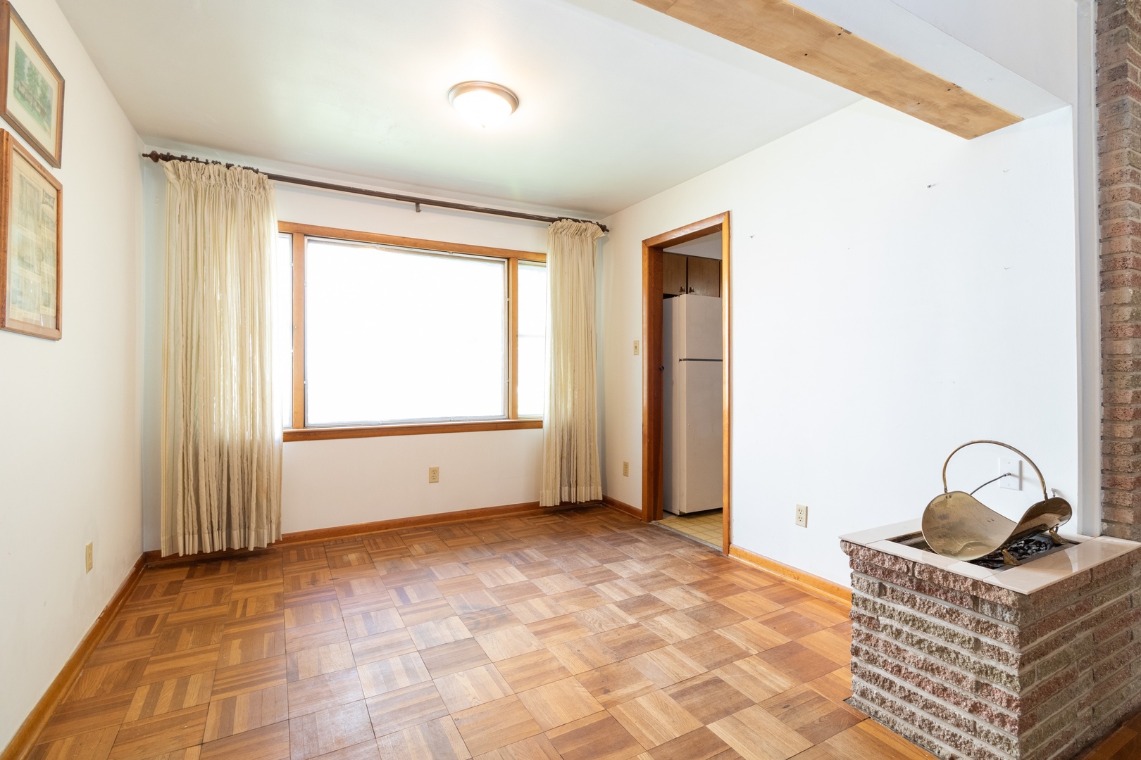 3604 177th Place Lansing, IL 60438 - Photo 5 of 13 a view of an empty room with window and hardwood floor