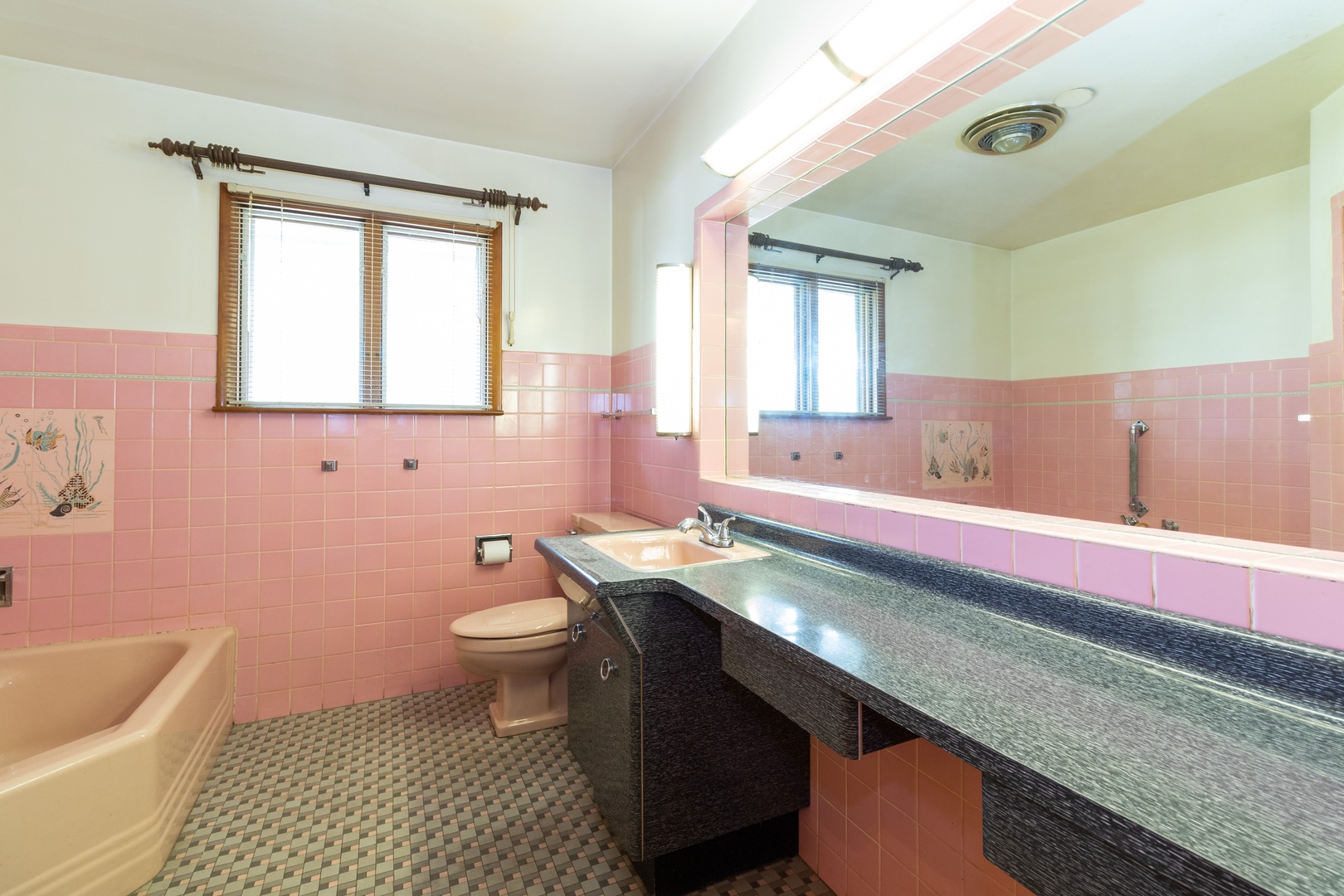 3604 177th Place Lansing, IL 60438 - Photo 8 of 13 a bathroom with a granite countertop sink a toilet a mirror and bathtub