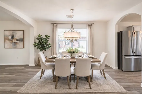 a view of a dining room with furniture window and wooden floor