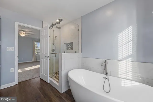 a bathroom with a double vanity sink a toilet and a window