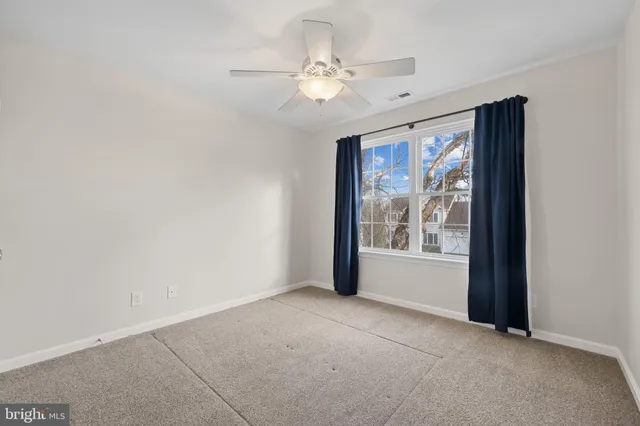 a bathroom with a bathtub shower sink vanity and toilet