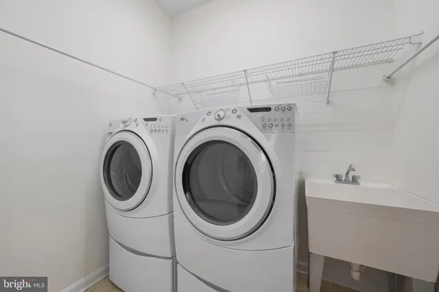 a view of a chandelier in big room and chandelier fan