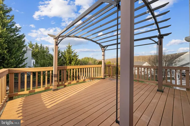a view of a house with a yard balcony and sitting area