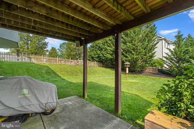 a view of a balcony with wooden floor