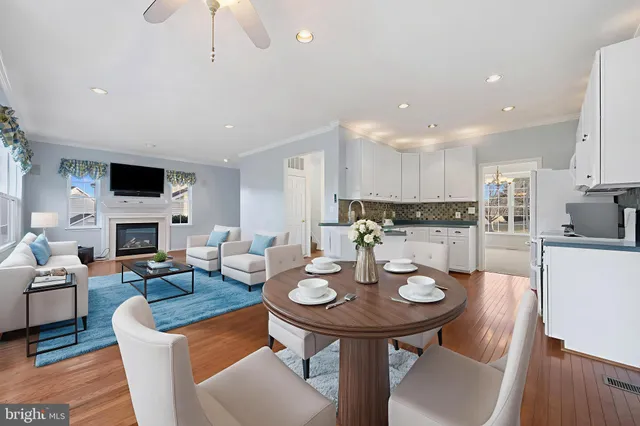 a view of a dining room with furniture and a fireplace