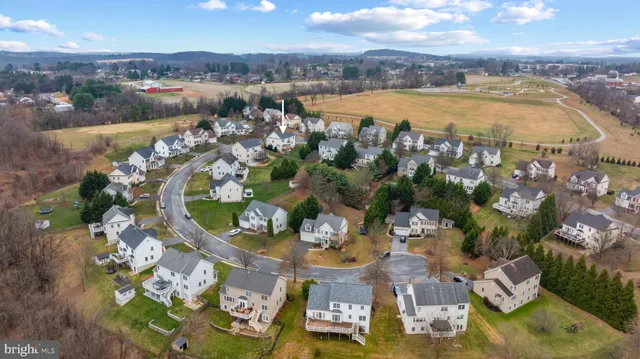 a view of a lake in front of residential houses