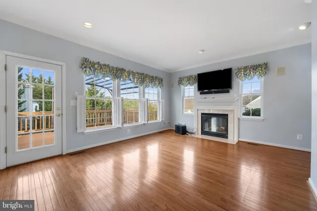 a view of kitchen with cabinets microwave and stove