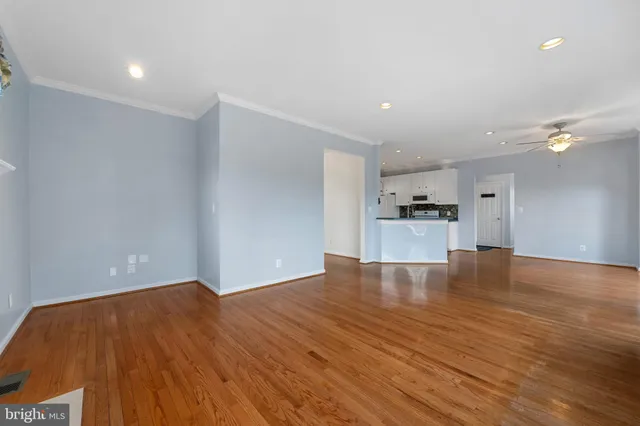 a large kitchen with cabinets a sink and appliances
