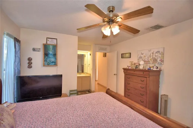 a bedroom with a bed and a dresser