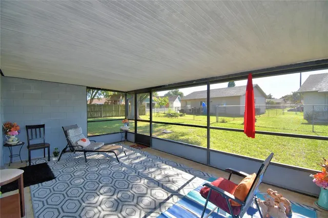a view of back yard with outdoor seating