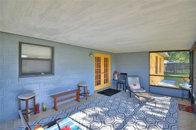 a living room with furniture and a window