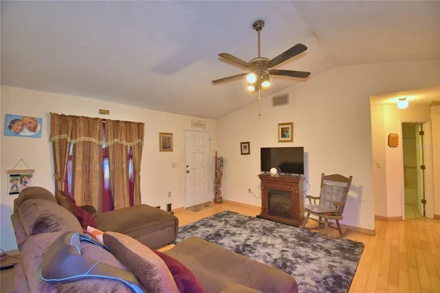 a bedroom with a bed furniture and a flat screen tv