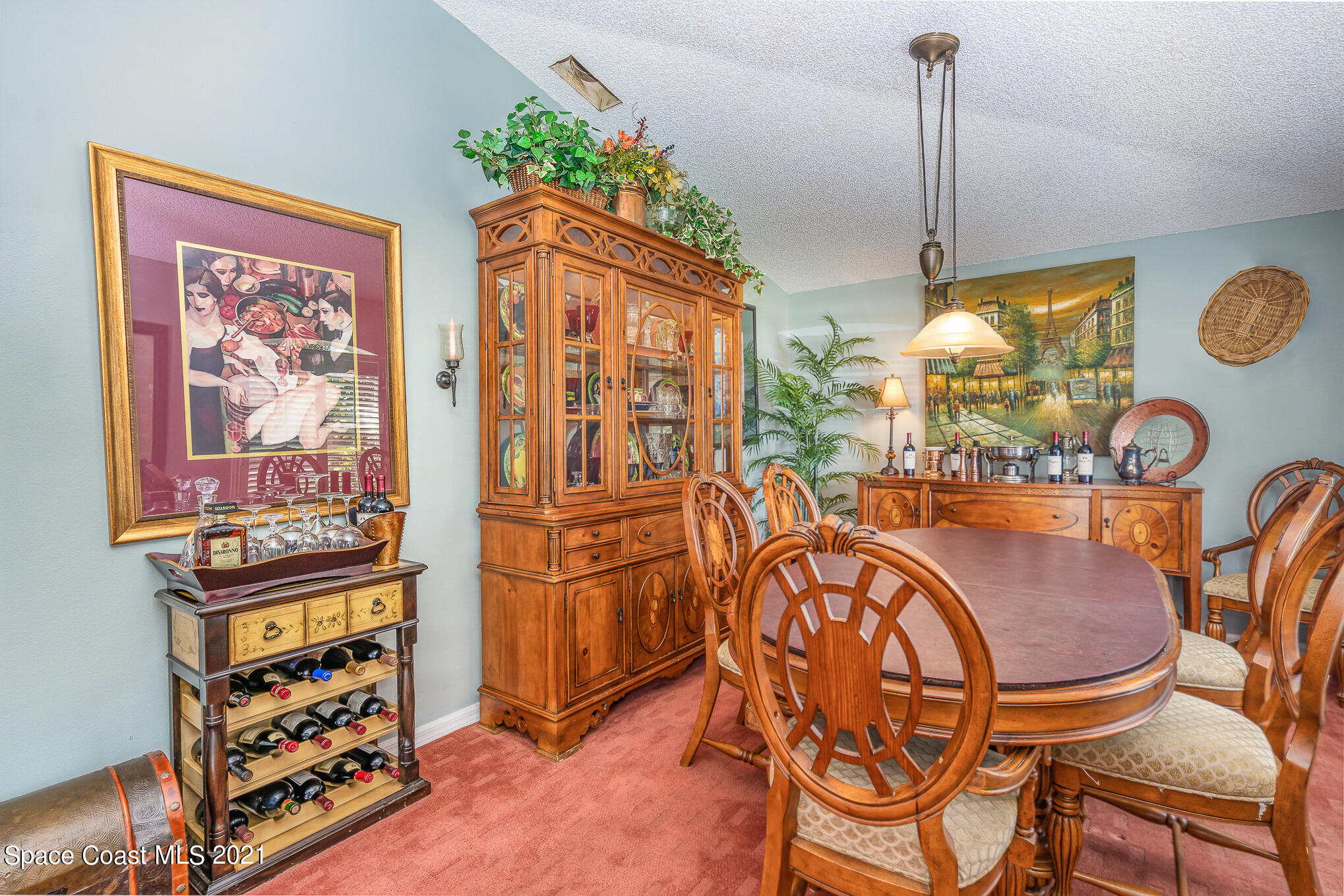 6330 Irving Road Cocoa, FL 32927 - Photo 3 of 22 a view of a dining room with furniture one side kitchen view and wooden floor