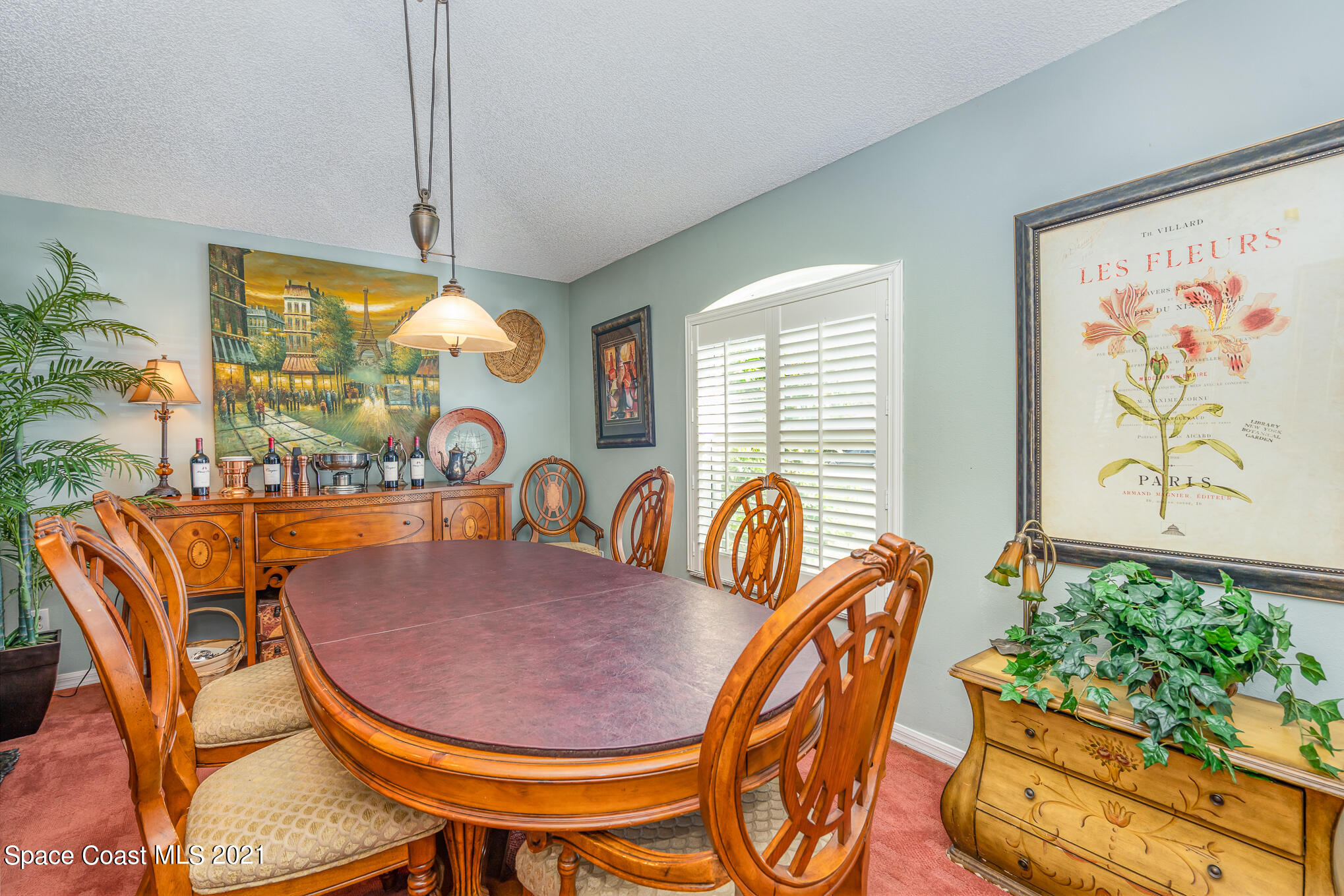 6330 Irving Road Cocoa, FL 32927 - Photo 4 of 22 a dining room with furniture and a large window