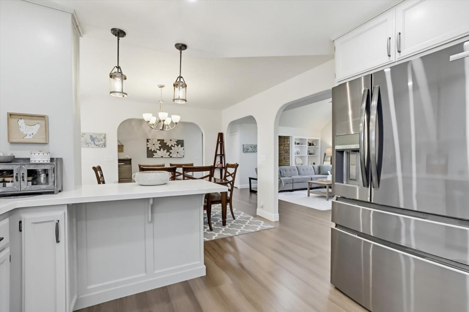 18639 Fay Ridge Court Grass Valley, CA 95949 - Photo 16 of 99 a kitchen with stainless steel appliances kitchen island a refrigerator and a stove top oven