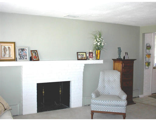 18 Lyndon Road Sharon, MA 02067 - Photo 4 of 12 a living room with furniture and wall painting