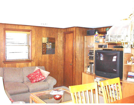 18 Lyndon Road Sharon, MA 02067 - Photo 6 of 12 a living room with a couch and a table