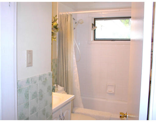 18 Lyndon Road Sharon, MA 02067 - Photo 7 of 12 a bathroom with a bathtub and a shower