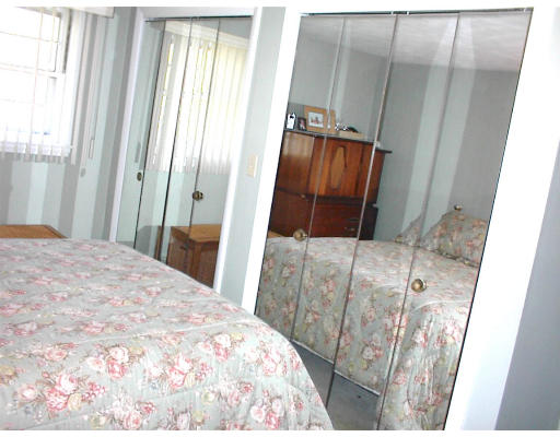 18 Lyndon Road Sharon, MA 02067 - Photo 8 of 12 a bedroom with a bed and a mirror