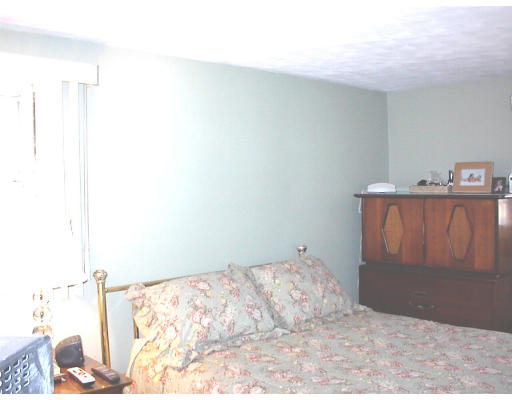 18 Lyndon Road Sharon, MA 02067 - Photo 9 of 12 a bedroom with a bed and a couch