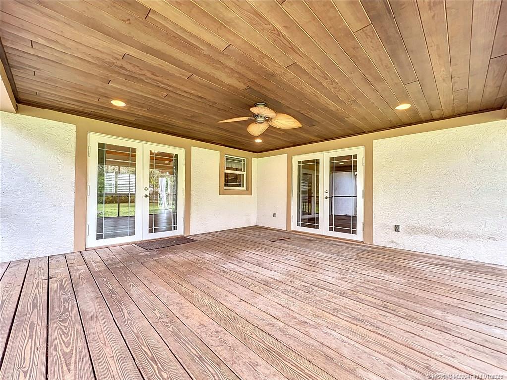 Back porch off the kitchen and primary bedroom wit