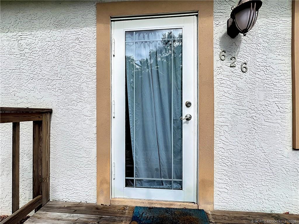 626 Russ Road Fort Pierce, FL 34982 - Photo 52 of 72 Front porch with an impact French door.