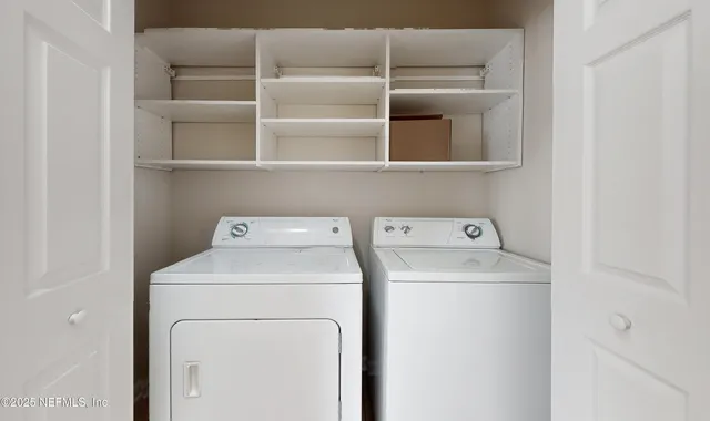 a utility room with dryer and washer
