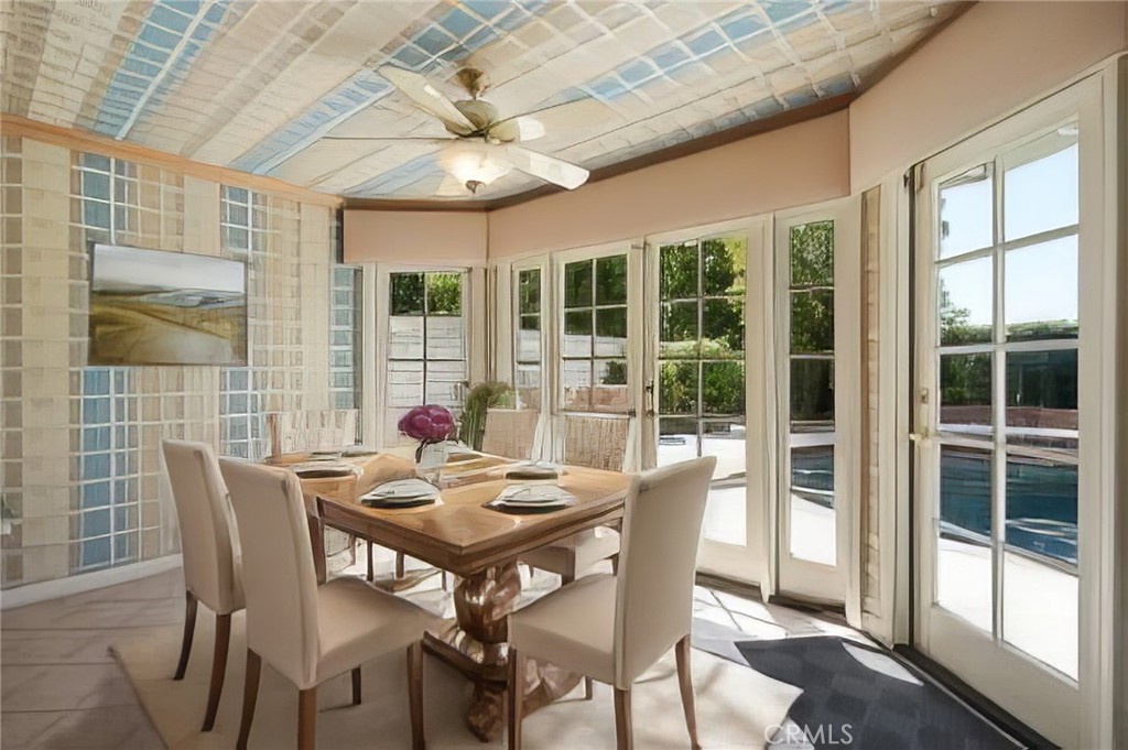 18782 Willowtree Lane Porter Ranch, CA 91326 - Photo 12 of 33 a view of a dining room with furniture large windows and wooden floor
