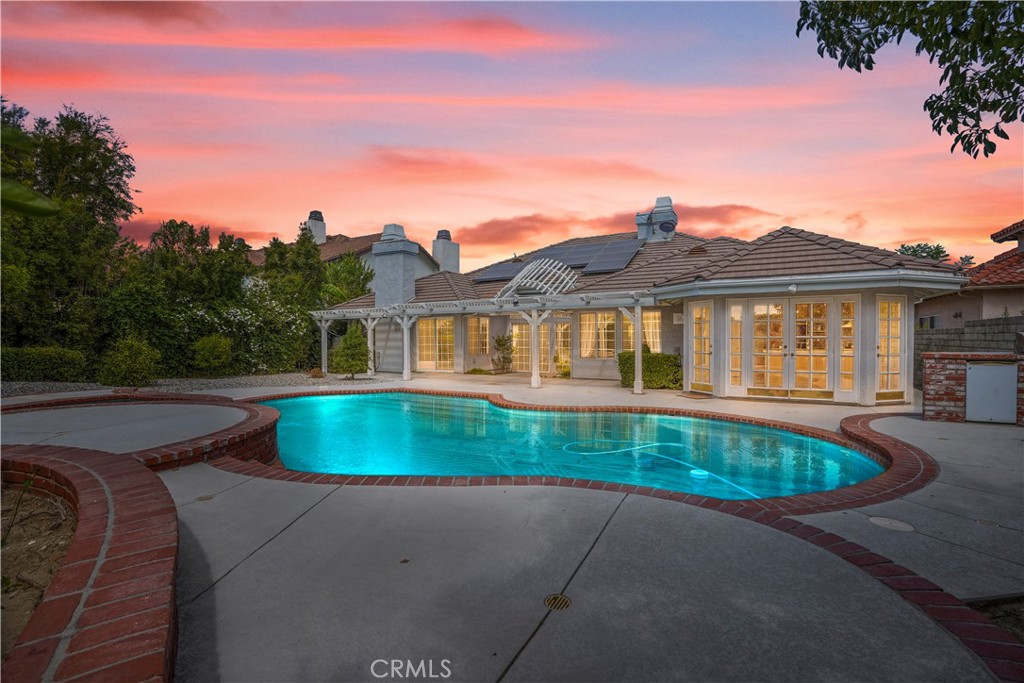 18782 Willowtree Lane Porter Ranch, CA 91326 - Photo 2 of 33 a front view of a house with garden