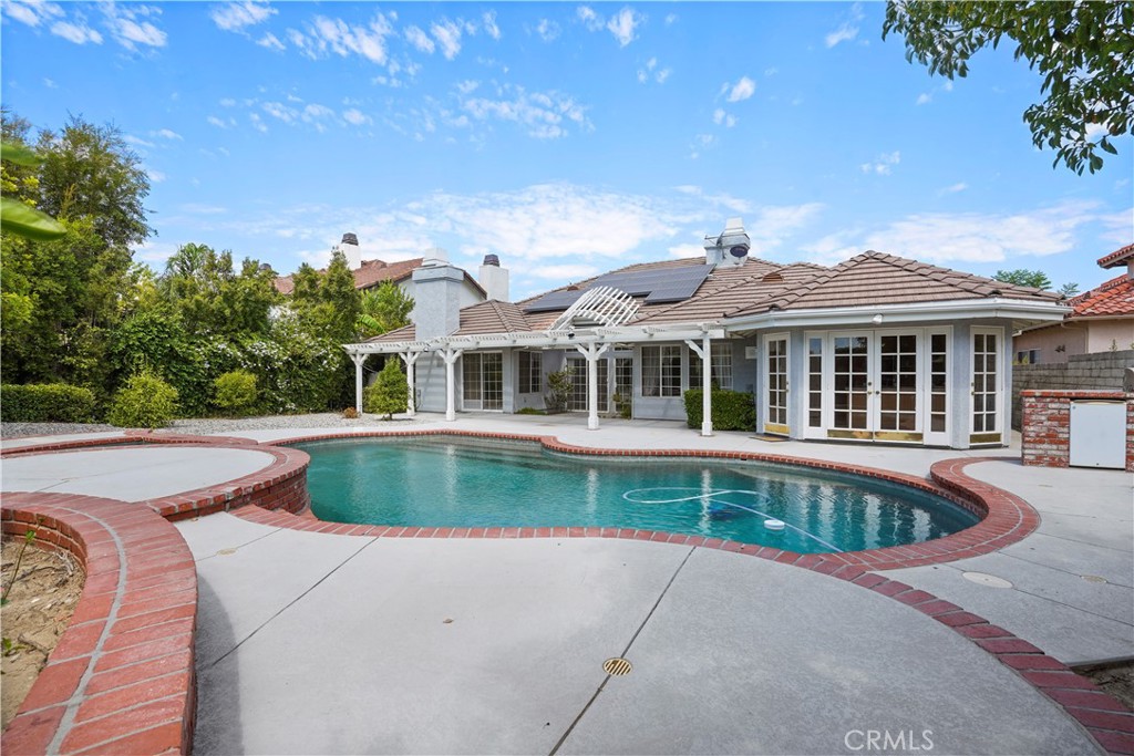 18782 Willowtree Lane Porter Ranch, CA 91326 - Photo 5 of 33 a front view of a house with a yard