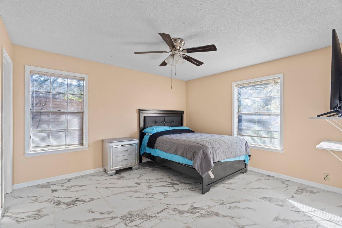 3442 Wythe Road Memphis, TN 38134 - Photo 8 of 21 a spacious bedroom with a bed and window