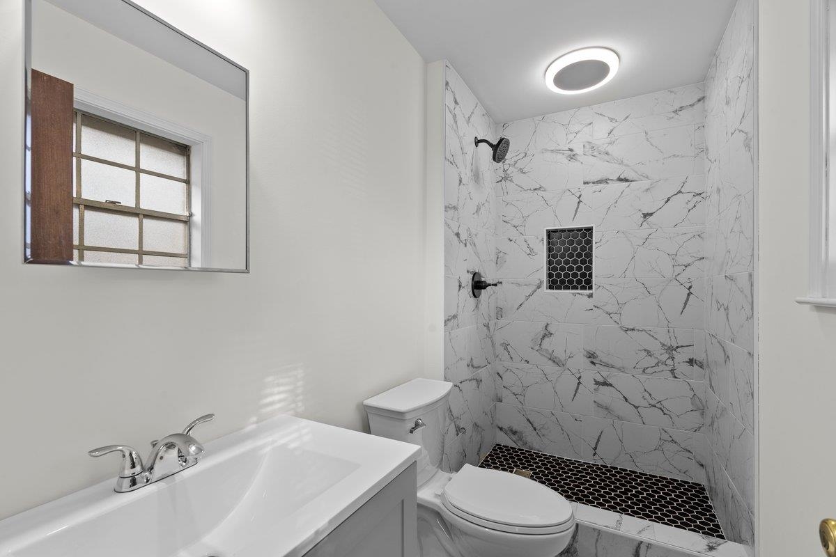 3442 Wythe Road Memphis, TN 38134 - Photo 9 of 21 a bathroom with a sink a toilet and shower