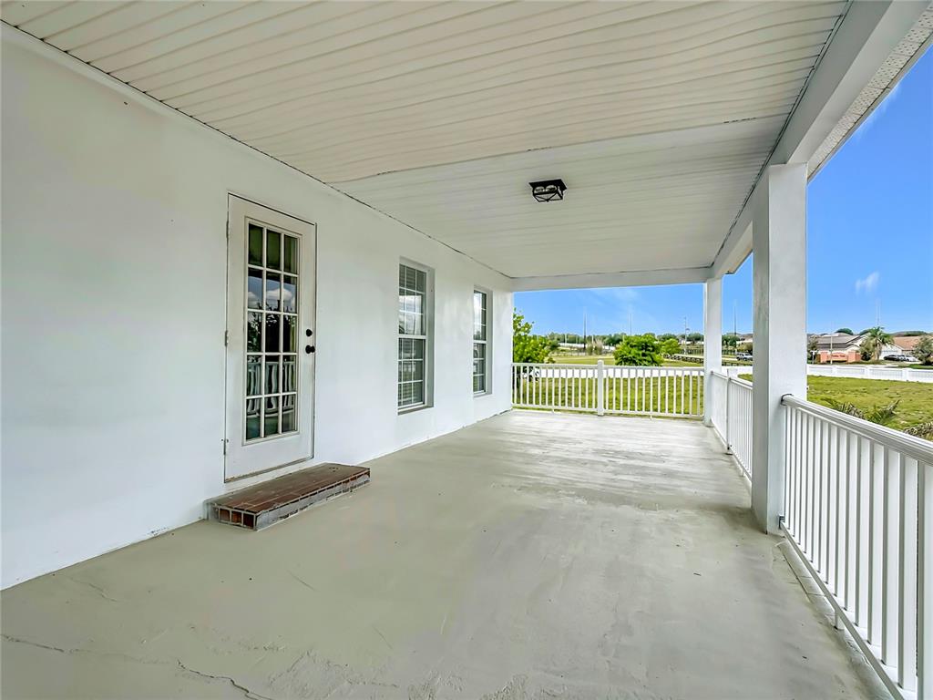 7925 Lake Mabel Loop Road Lake Wales, FL 33898 - Photo 85 of 97 a view of a porch with wooden floor and outer view