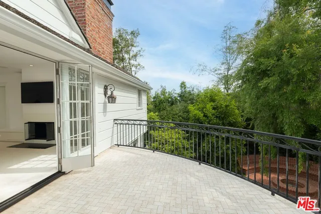 a backyard of a house with yard and outdoor seating