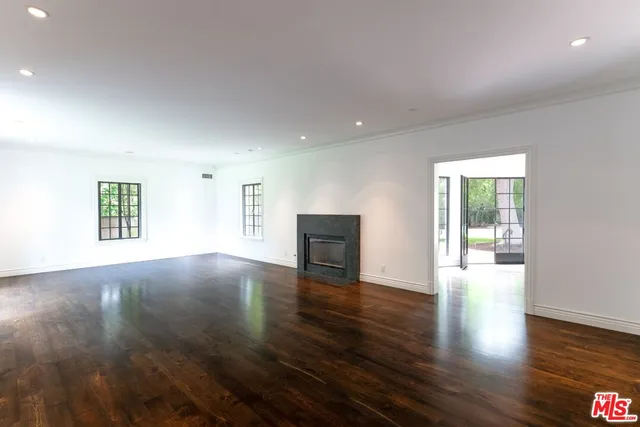 a view of an entryway with wooden floor