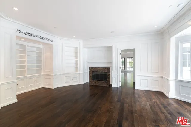 a view of a house with backyard sitting area and garden