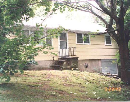 4 Pine Tree Road Monroe, CT 06468 - Photo 1 of 1 a front view of a house with a yard