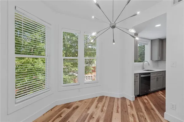 a view of kitchen with sink and natural light